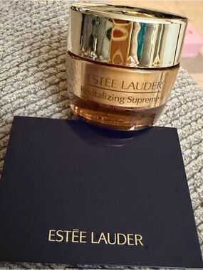Estee Lauder Revitalizing Supreme+ and mini eyeshadow palette with 4 colors.